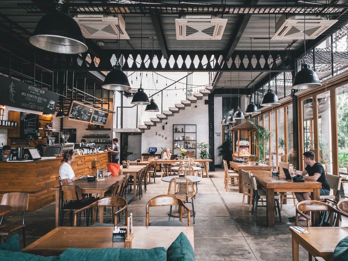 Tables set inside a neighbourhood eatery